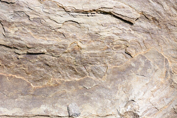 rough texture of gray stone. natural rock background shot outside
