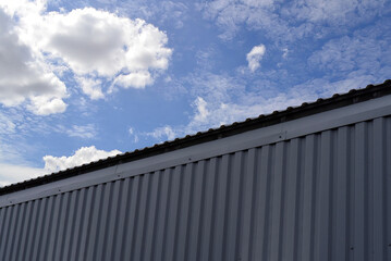 A building with a corrugated metal profile on wall