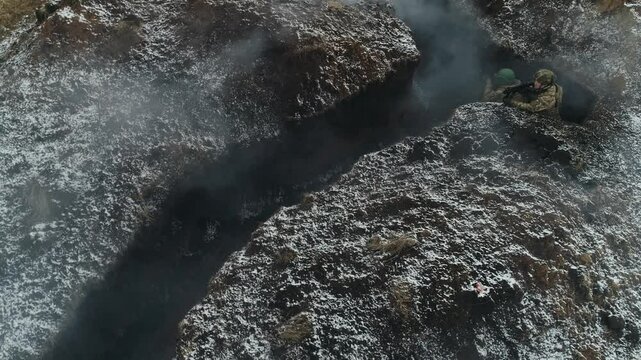 Soldiers in the trenches and smoke from explosions aerial view