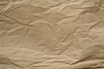 brown crumpled paper texture as background, old kraft paper as background, crumpled packing material texture as background photo above