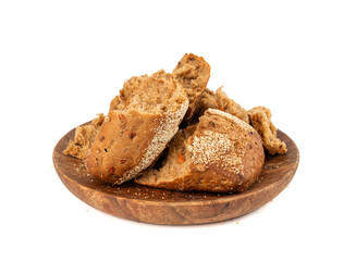 Broken wheat brown bread pieces isolated, fitness pumpkin carrot buns with seeds, cereal bread