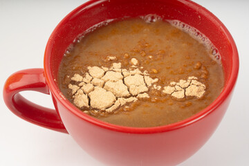 Maca powder drink isolated, dry Peruvian ginseng beverage, powder in water, ground ayak willku tea