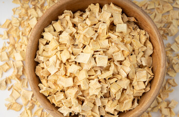 Dry parsley root, dried diced celery cubes, scattered small liquorice pileces, dry vegetable