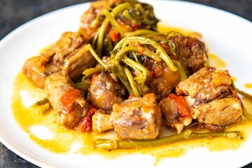 Traditional beef oxtail with watercress, a rustic Brazilian dish