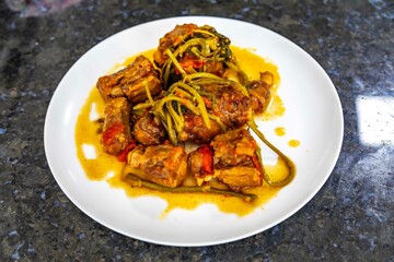 Traditional beef oxtail with watercress, a rustic Brazilian dish