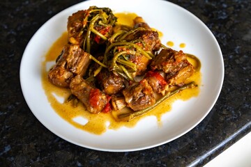 Traditional beef oxtail with watercress, a rustic Brazilian dish