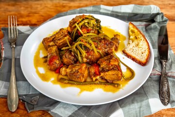 Traditional beef oxtail with watercress, a rustic Brazilian dish