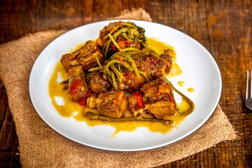 Traditional beef oxtail with watercress, a rustic Brazilian dish