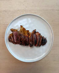 A plate of striploin steak.