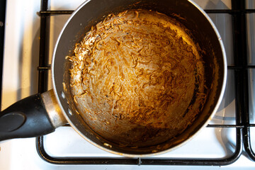 dirty pot with dry noodle inside