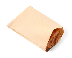 Paper bag with freshly baked bun isolated on white, above view