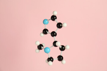 Chemical model of molecule on pink background