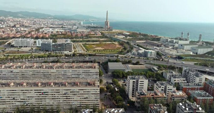 Aerial view industrial urban landscape of Barcelona. Port and manufacturing plants on the seashore in Catalonia. High quality 4k footage
