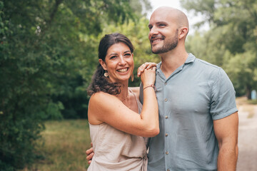 Fototapeta premium Loving couple sharing a joyful moment in nature