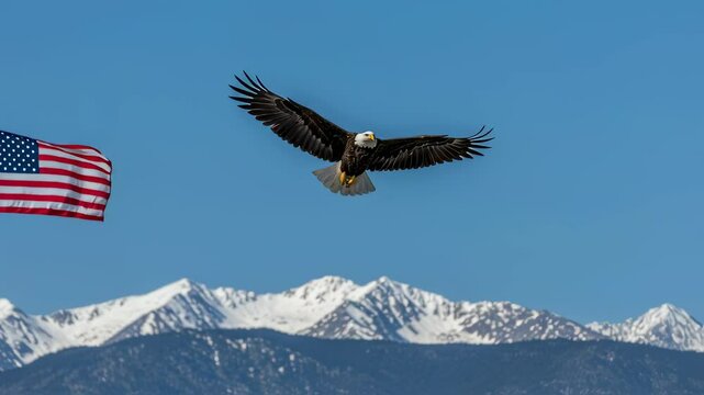 Bald eagle soars near american flag with snow-capped mountains in background. Freedom flight patriotic motion footage for veterans day. copy space aerial beauty