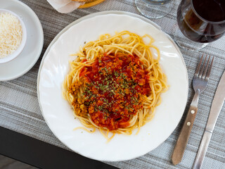 Italian bolonesa, bolognese noodles with tomato sauce and cheese in a cafe