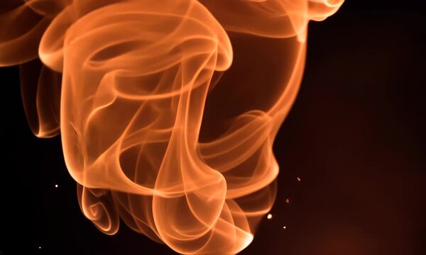 Dramatic Orange Smoke Trails Emerge From the Darkness Creating Abstract Patterns And Shapes Flowing Movement and Energy Against a Black Backdrop