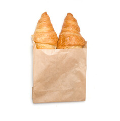 bag of croissants on white background