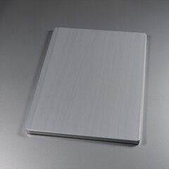 Grey metallic surface reflective of stainless steel textures on a gradated background