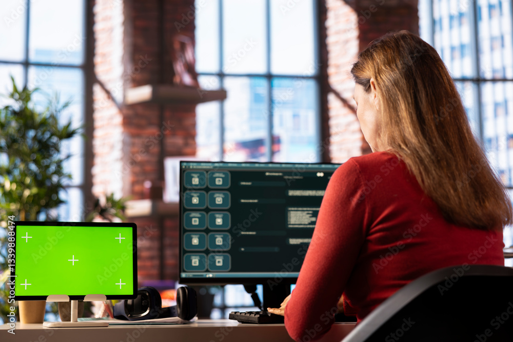 Poster mature woman engaging with ai chatbot on pc next to isolated display, using the virtual assistant wi
