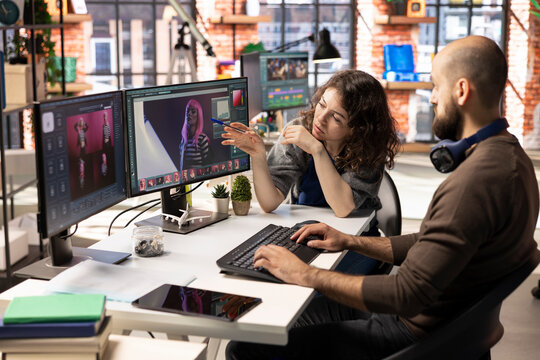 Man and woman creative team using AI to generate image models, operating an editing software to enhance digital materials and create quality content. AI assistant with photo retouching. - Powered by Adobe