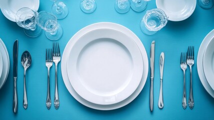 Elegant Table Setting With White Plates And Silverware
