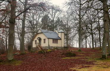 Swedish chapel in a tranquil forest setting. Traditional swedish house. 