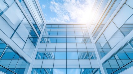 Obraz premium Modern Glass Building Architecture: A Stunning Upward View