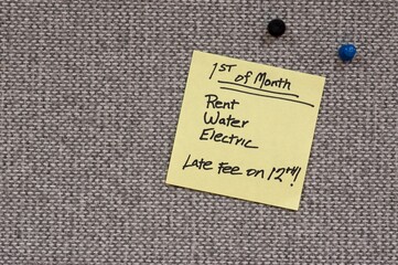 Sticky note reminder for utilities due on the First of the Month