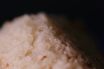 Macro shot of wheat bread with molds starting to growth on surface
