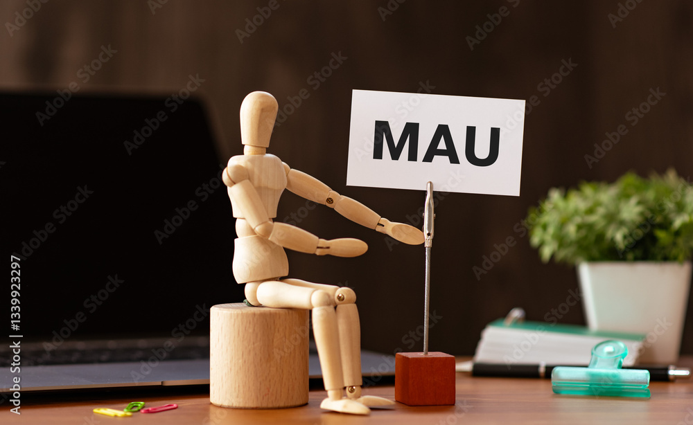 Poster there is wood block with the word mau. it is an abbreviation for monthly active users as eye-catchin