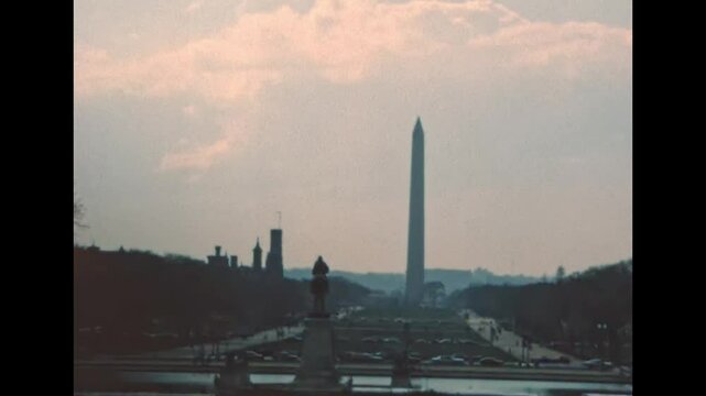 Washington Monument obelisk in the 1980s in Washington DC capital city. Surrounded by American flags, in National Mall park of the United States. Historical archival of America in the year 1980.