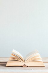 Serene study session with open book on a wooden desk for learning and reflection