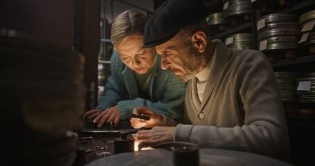 Exploring Vintage Film Reels within a Dimly Lit Archive Filled with Incredible Treasures