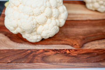 Fresh cauliflower on a wooden background