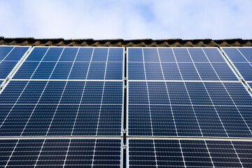 Photovoltaic panels providing sustainable energy on a rooftop