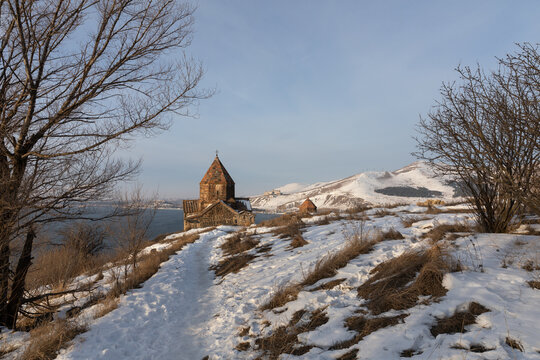 Sevanavank Monastery on the Sevan Peninsula during a cold early winter morning, at sunrise, overlooking the vast Lake Sevan. One of Armenia&rsquo;s most popular travel and cultural destinations
