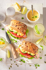 Healthy sandwich with curry chicken, lettuce and tomato.