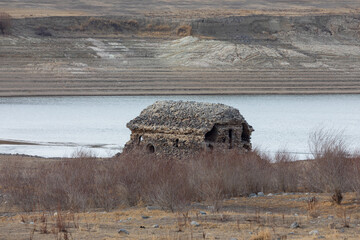 St. Karapet Church emerging from Tolors Reservoir in Syunik, Armenia. Historic site is submerged...