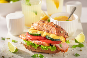 Healthy sandwich made of spicy chicken and vegetables.
