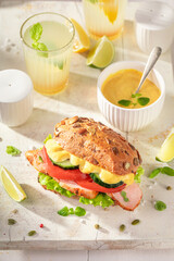 Homemade sandwich served with lemonade in summer.