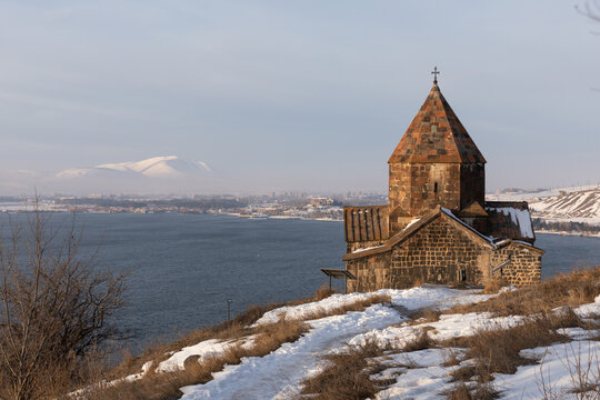 Sevanavank Monastery on the Sevan Peninsula during a cold early winter morning, at sunrise, overlooking the vast Lake Sevan. One of Armenia&rsquo;s most popular travel and cultural destinations