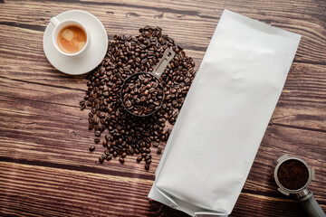 Coffee Beans and Blank Packaging on Wooden Table