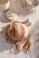 Tasty and homemade round loaf bread in home bakery.