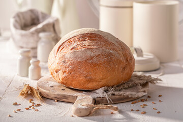 Crispy and rustic round loaf bread baked in home bakery.