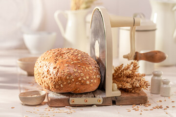 Closeup of loaf of oat bread baked in home bakery.