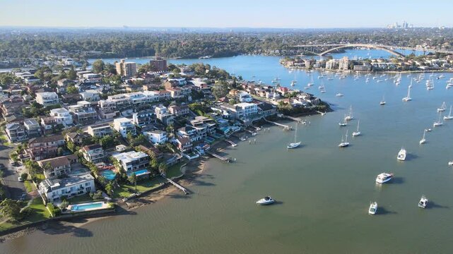 Aerial drone footage capturing sunset over Chiswick and Hunters Hill, showcasing the Parramatta River and Gladesville Bridge in the background.