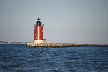 Delaware Breakwater East End Lighthouse Cape Henlopen Historic Red and White nautical light in early morning light © Laughing Willows