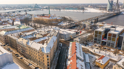 Obraz premium Riga, Latvia, Beautiful panoramic aerial photo from drone to Old Riga on a beautiful sunny winter day. (series)