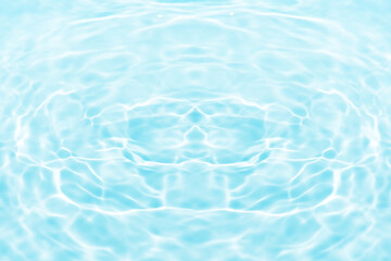 Blue water with ripples on the surface. Defocus blurred transparent blue colored clear calm water surface texture with splashes and bubbles. Water waves with shining pattern texture background.